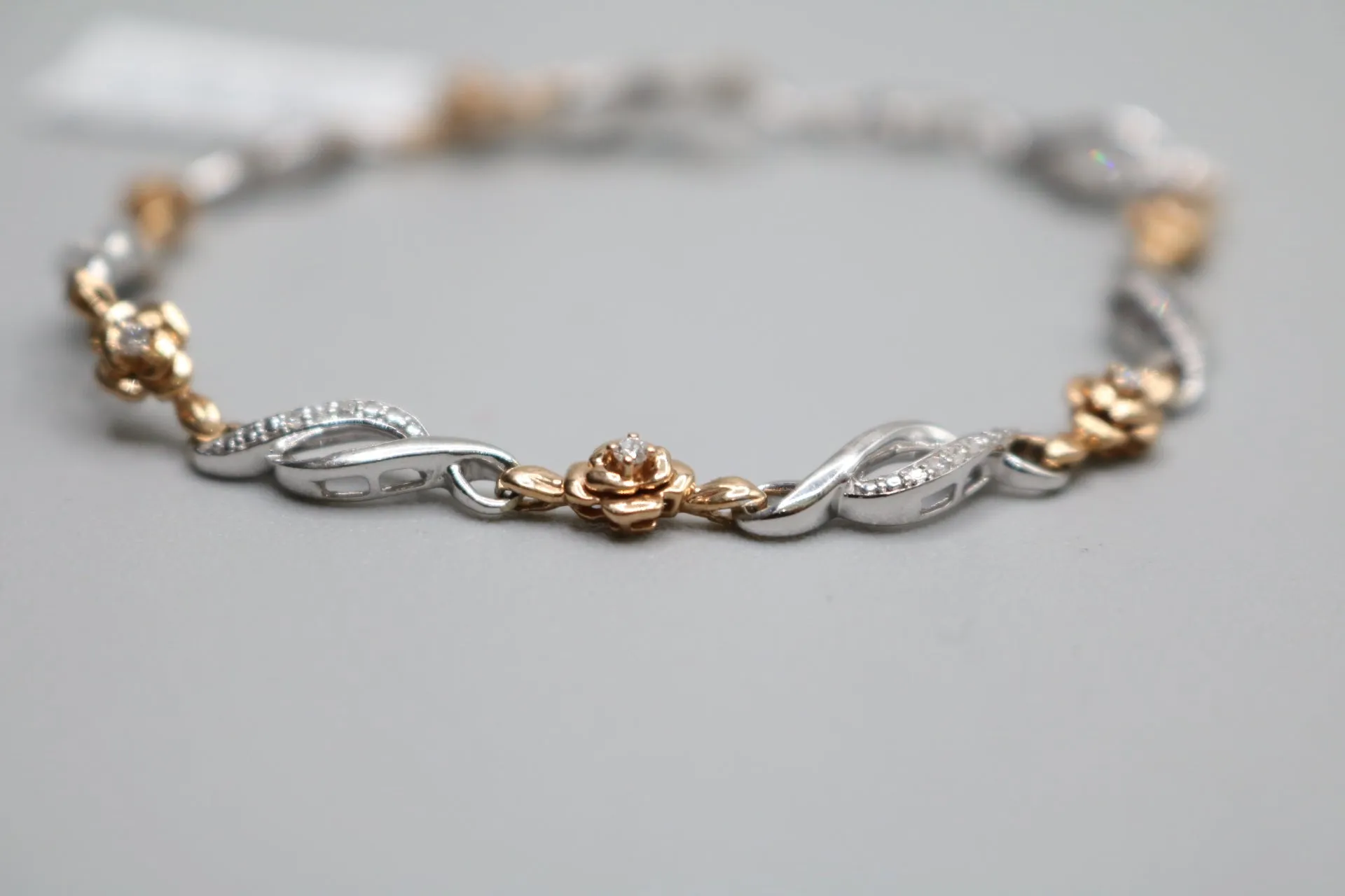 14K 2 Tone Gold Rose and Infinity Diamond Bracelet (.27CTW)(6 3/4")