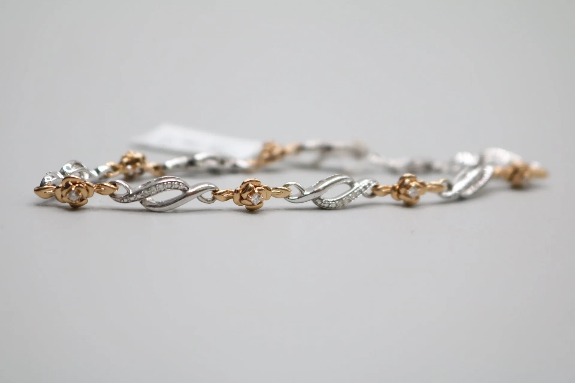 14K 2 Tone Gold Rose and Infinity Diamond Bracelet (.27CTW)(6 3/4")