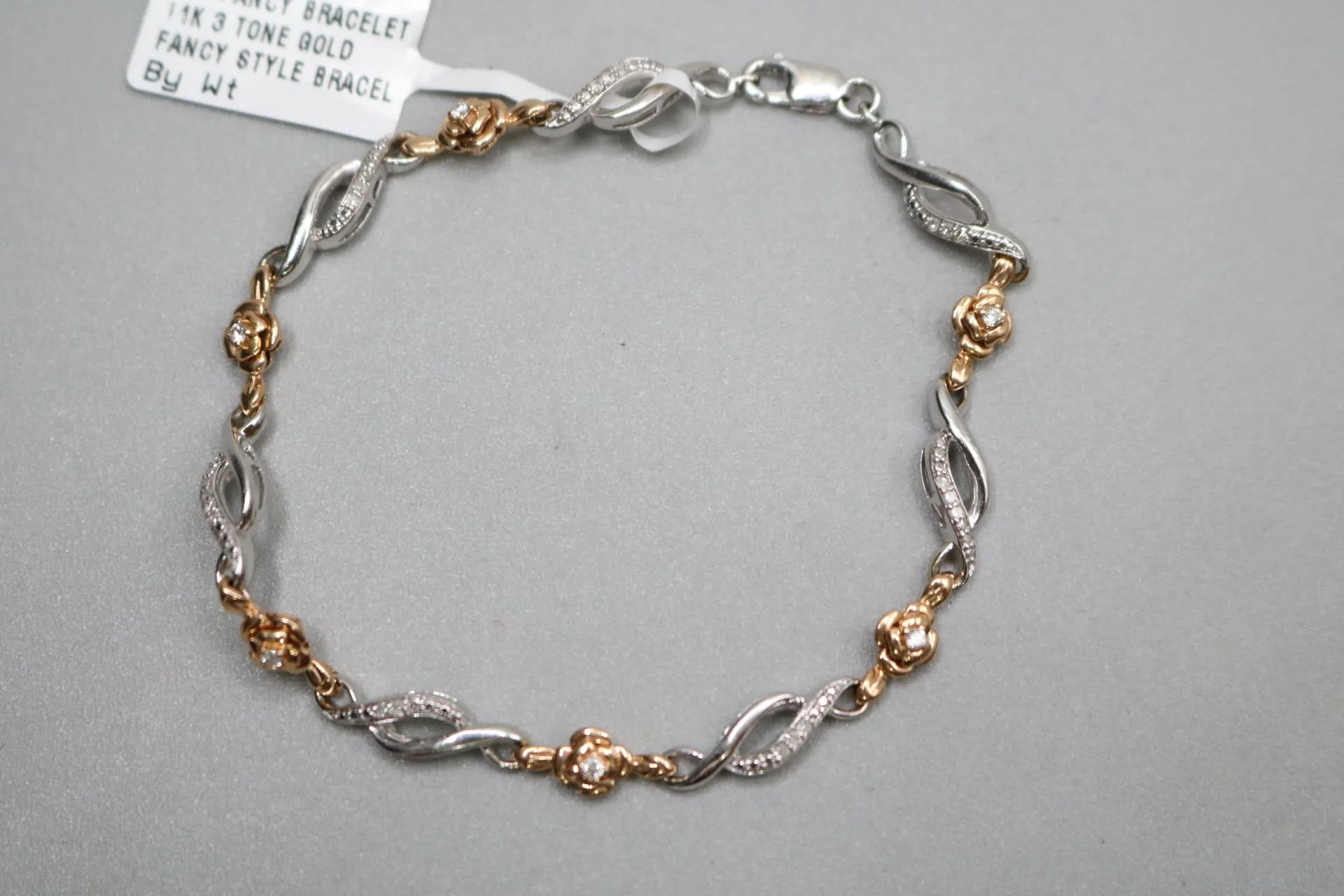 14K 2 Tone Gold Rose and Infinity Diamond Bracelet (.27CTW)(6 3/4")