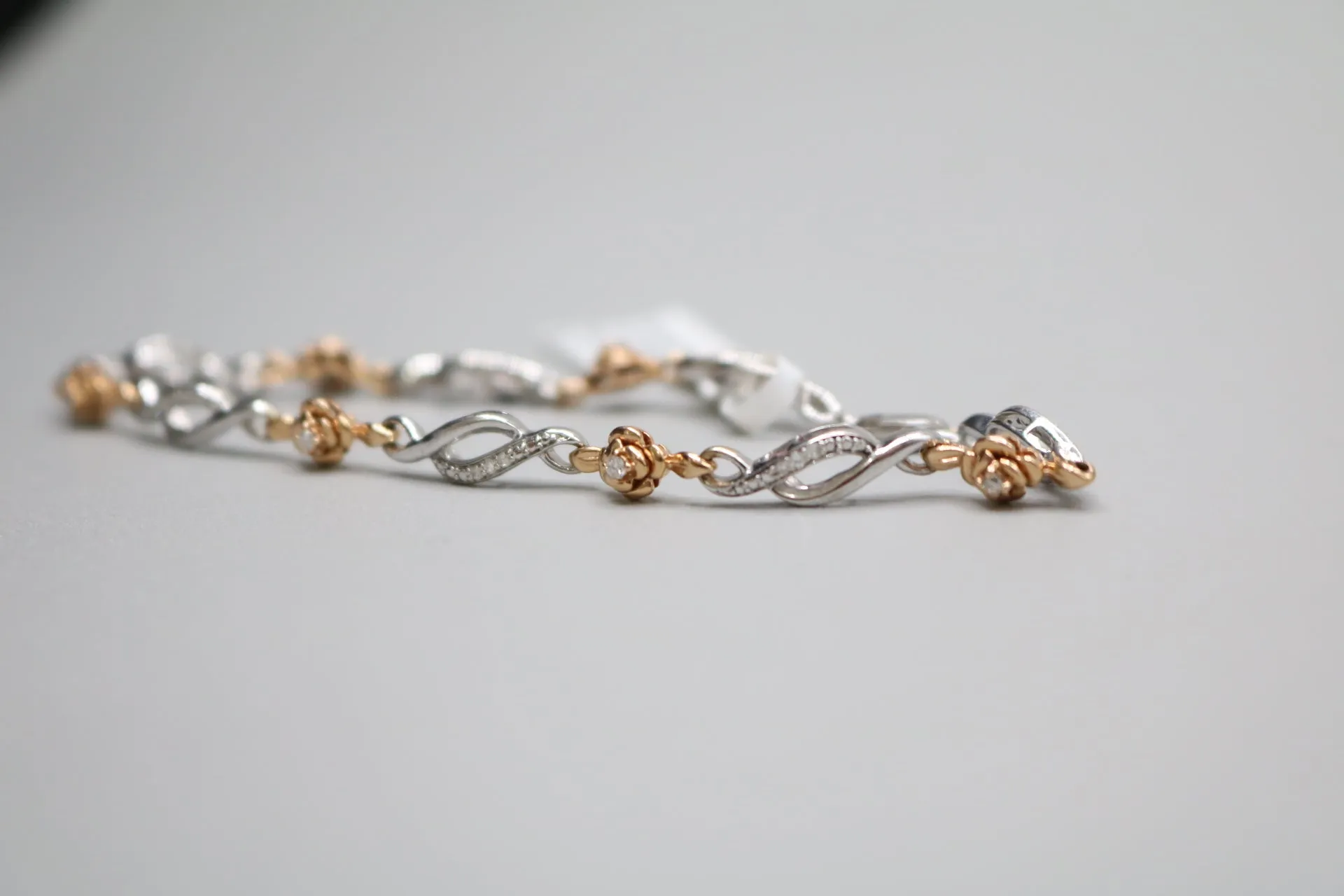 14K 2 Tone Gold Rose and Infinity Diamond Bracelet (.27CTW)(6 3/4")