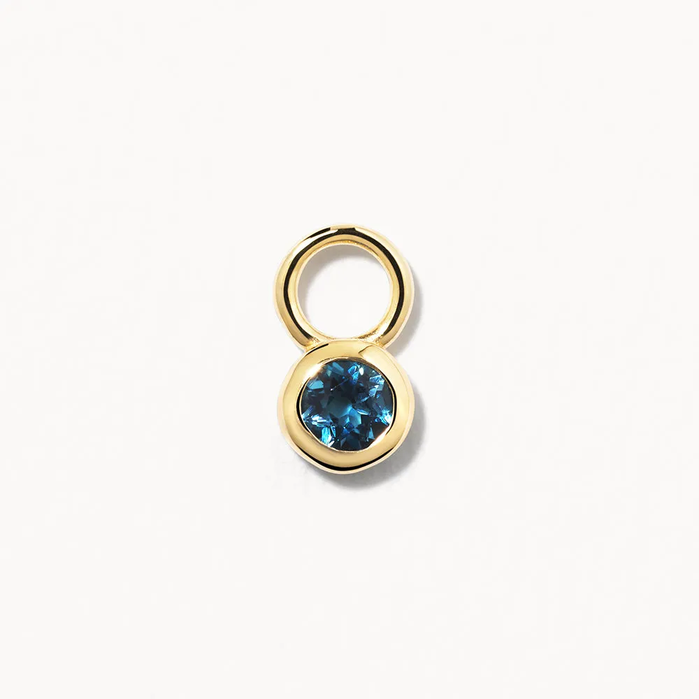 Blue Topaz Circle Charm in 10k Gold