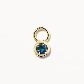Blue Topaz Circle Charm in 10k Gold