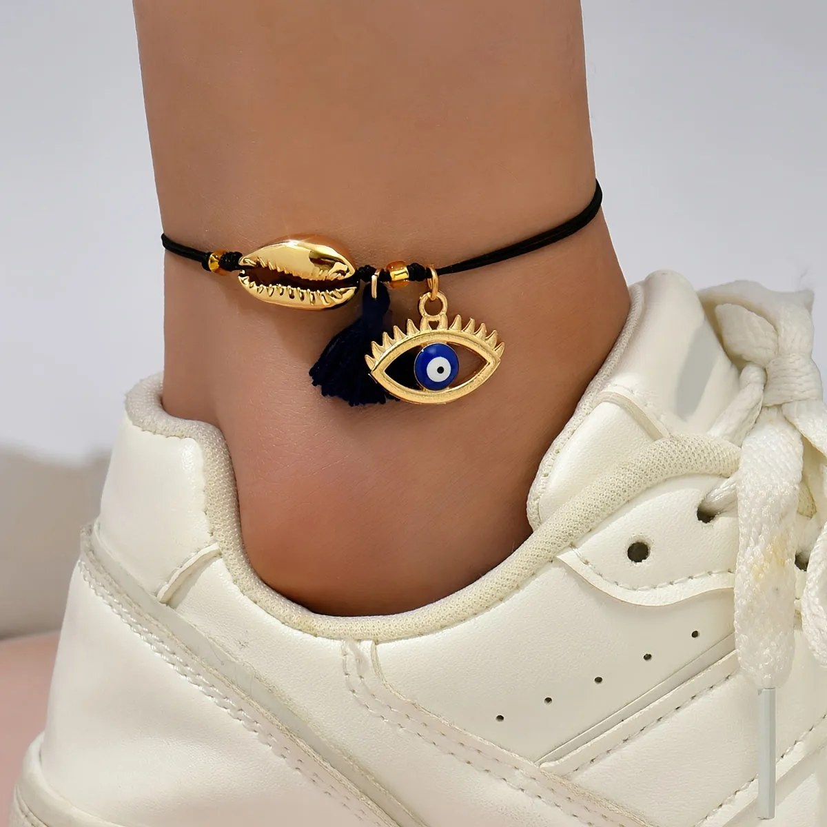 Enhance your style with Devils Eye Pendant Anklet