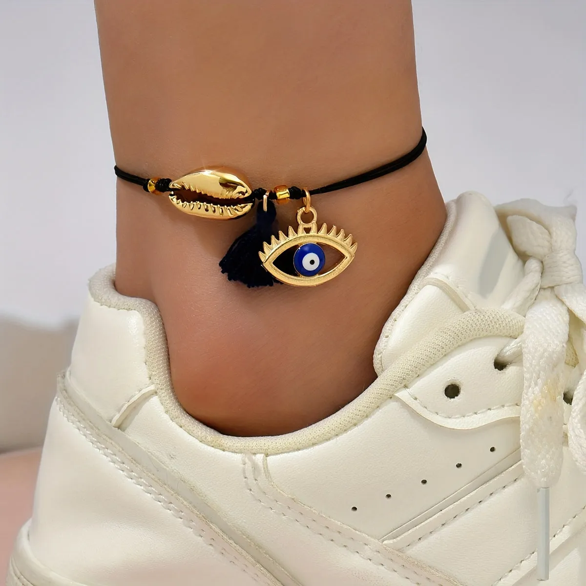 Enhance your style with Devils Eye Pendant Anklet
