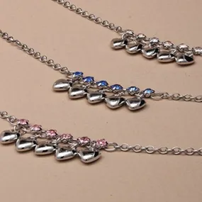 Silver coloured anklets in assorted Flower, Heart and Star designs with bell detail.